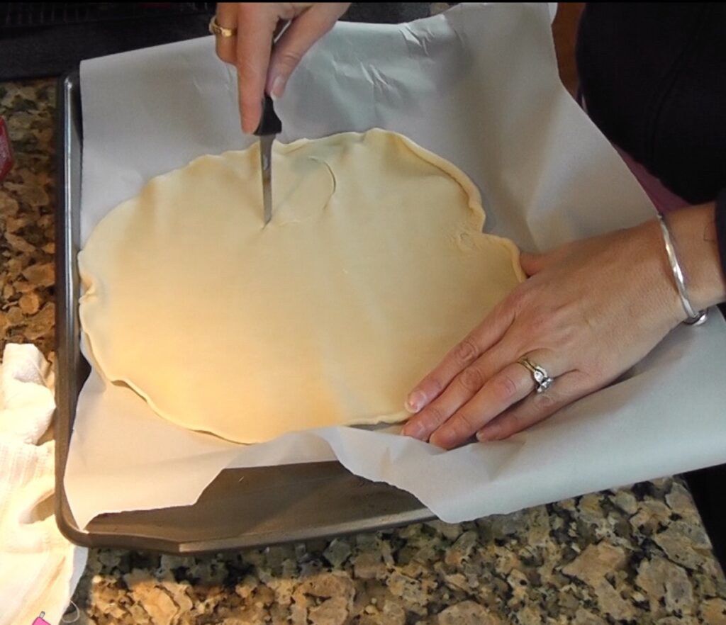 Cutting out pie dough with a knife