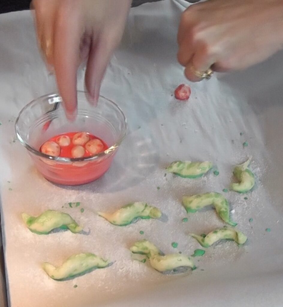 Dripping dough berries in red food coloring