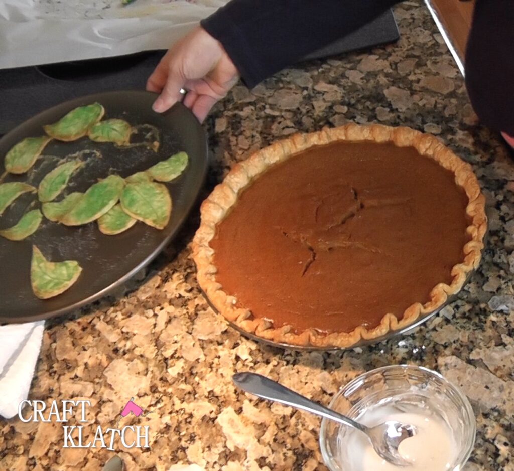 Pumpkin pie and baked green dough leaves