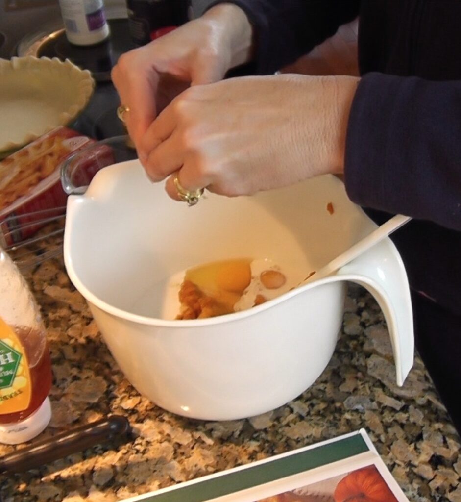 Pumpkin pie - Adding pumpkin pie ingredients into bowl