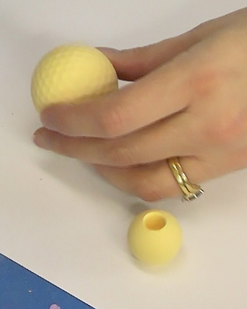 Golf ball and dowel head painted yellow