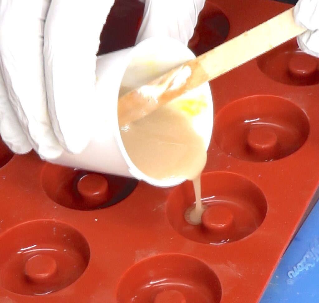 Pour colored resin into the silicone donut mold