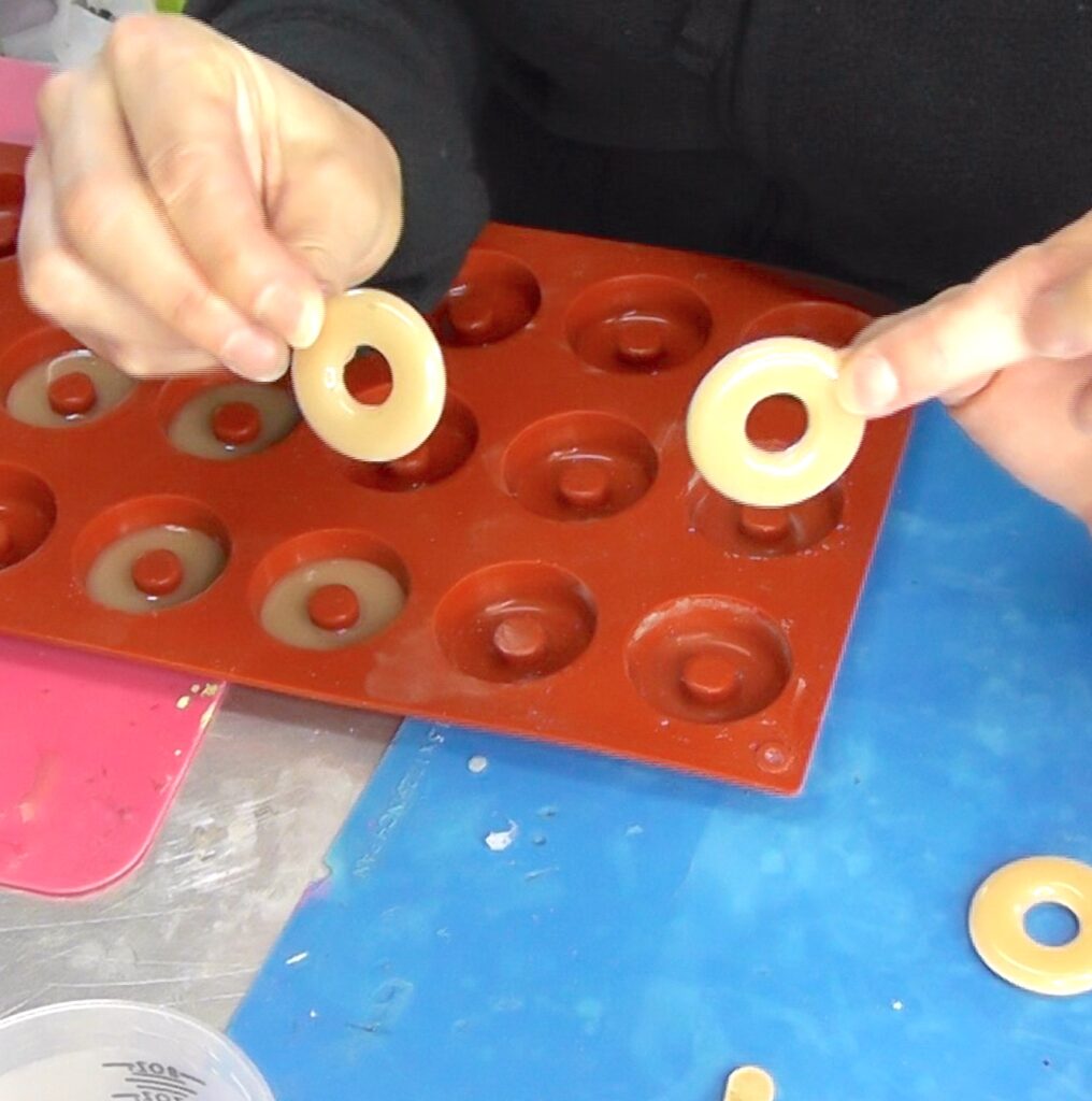 Two donut ring jewelry halves removed from mold