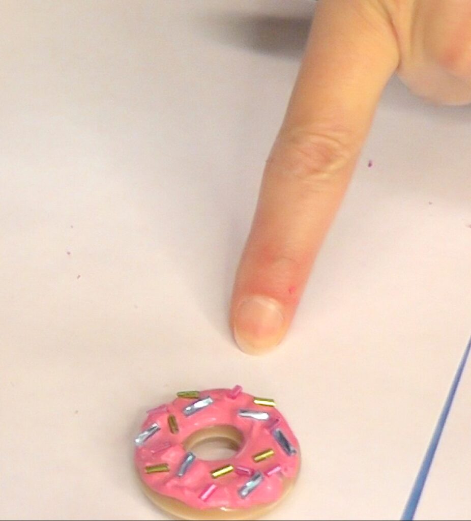 Donut ring jewelry with pink frosting and bugle beads for sprinkles