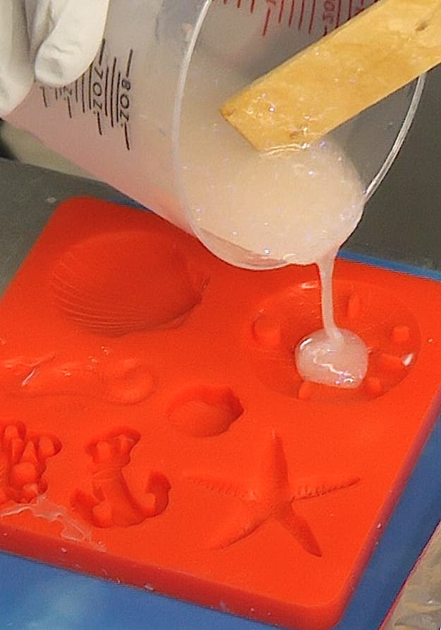Pouring glow in the dark resin into silicone mold