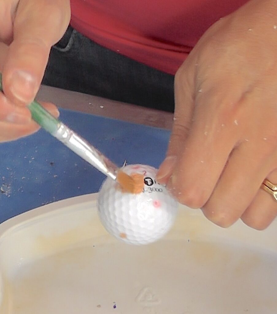 Paint the golf ball a flesh color