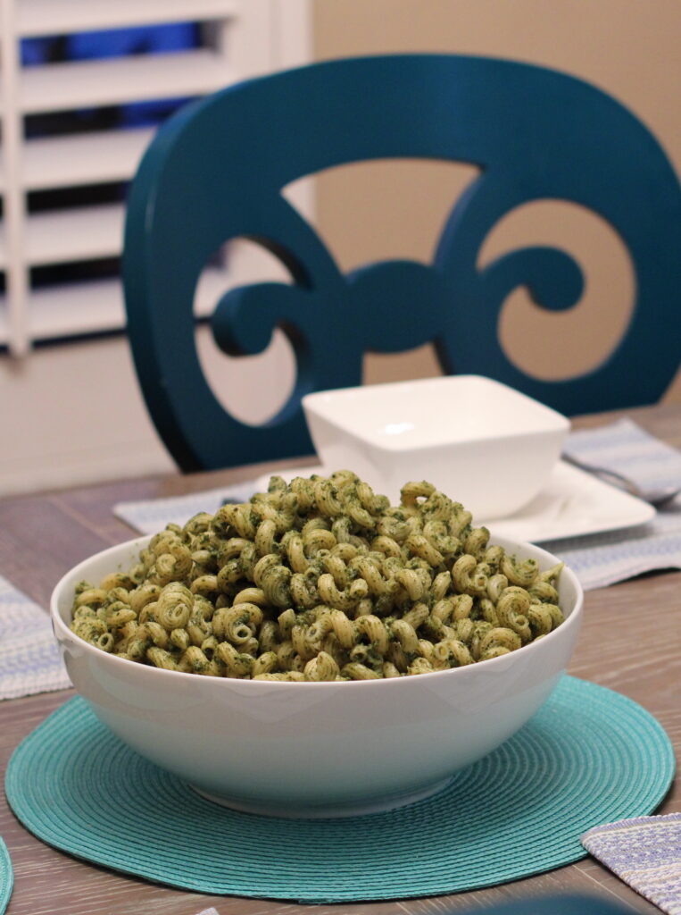 Bowl of pesto recipe on dining room table