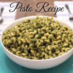 Pesto recipe | how to make pesto for pasta | white bowl filled with corkscrew pasta covered in pesto sauce