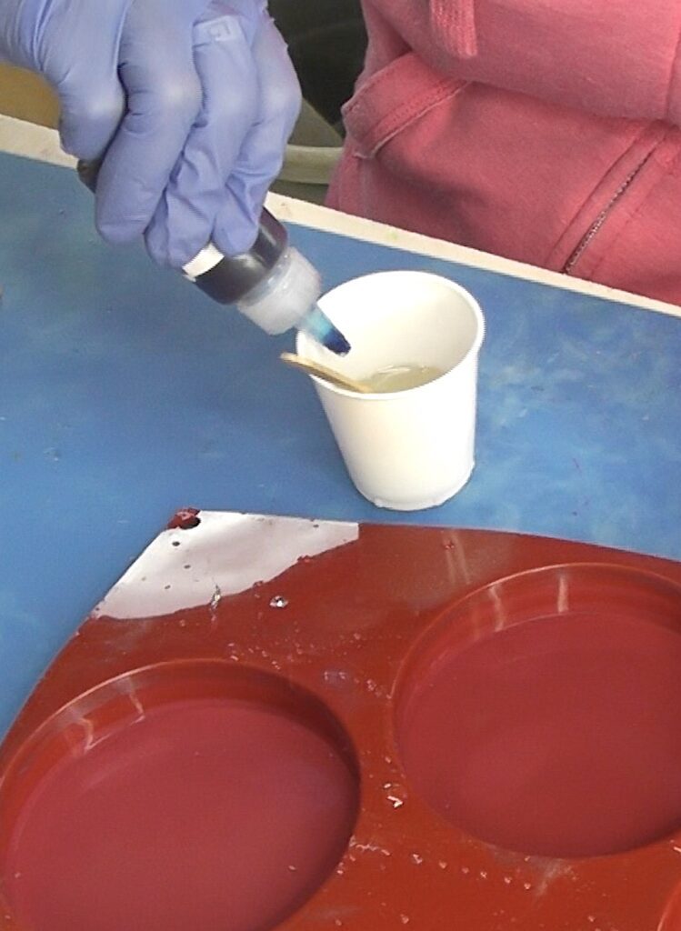 Add resin pigment into cup of resin