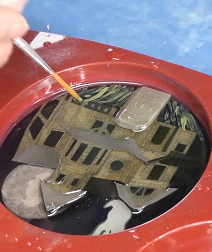 Paint the grass on the next layer of the haunted houses for Halloween