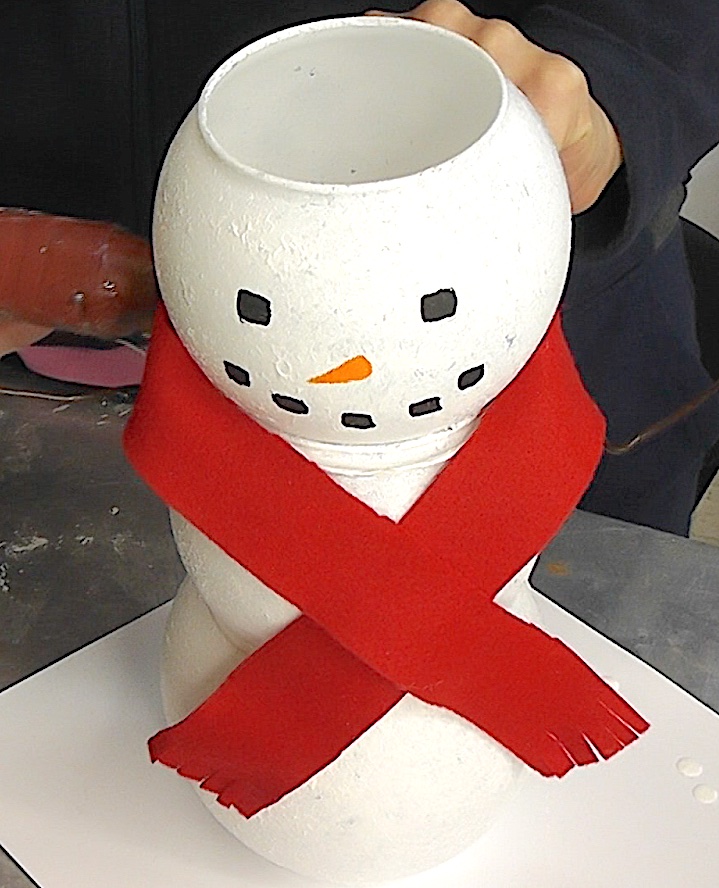 Wrap the red felt scarf around the neck of the Dollar Tree snowman with lights