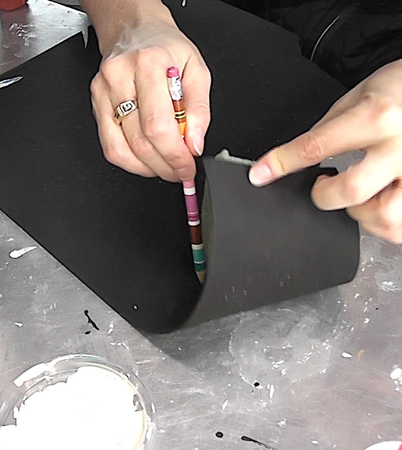 Roll floral foam in black craft foam and trace it