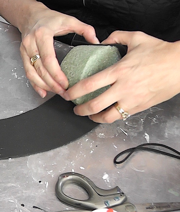 Roll floral foam in the black craft form and secure it with hot glue