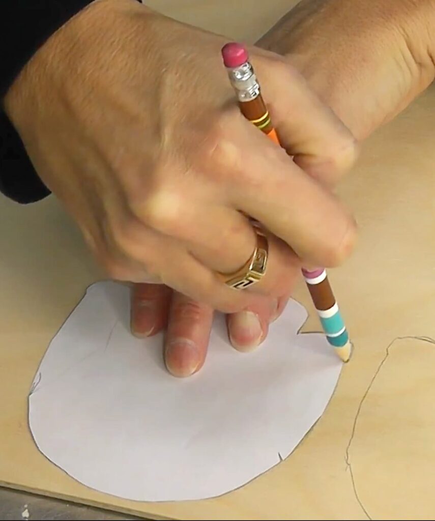 Tracing sweater template onto wood