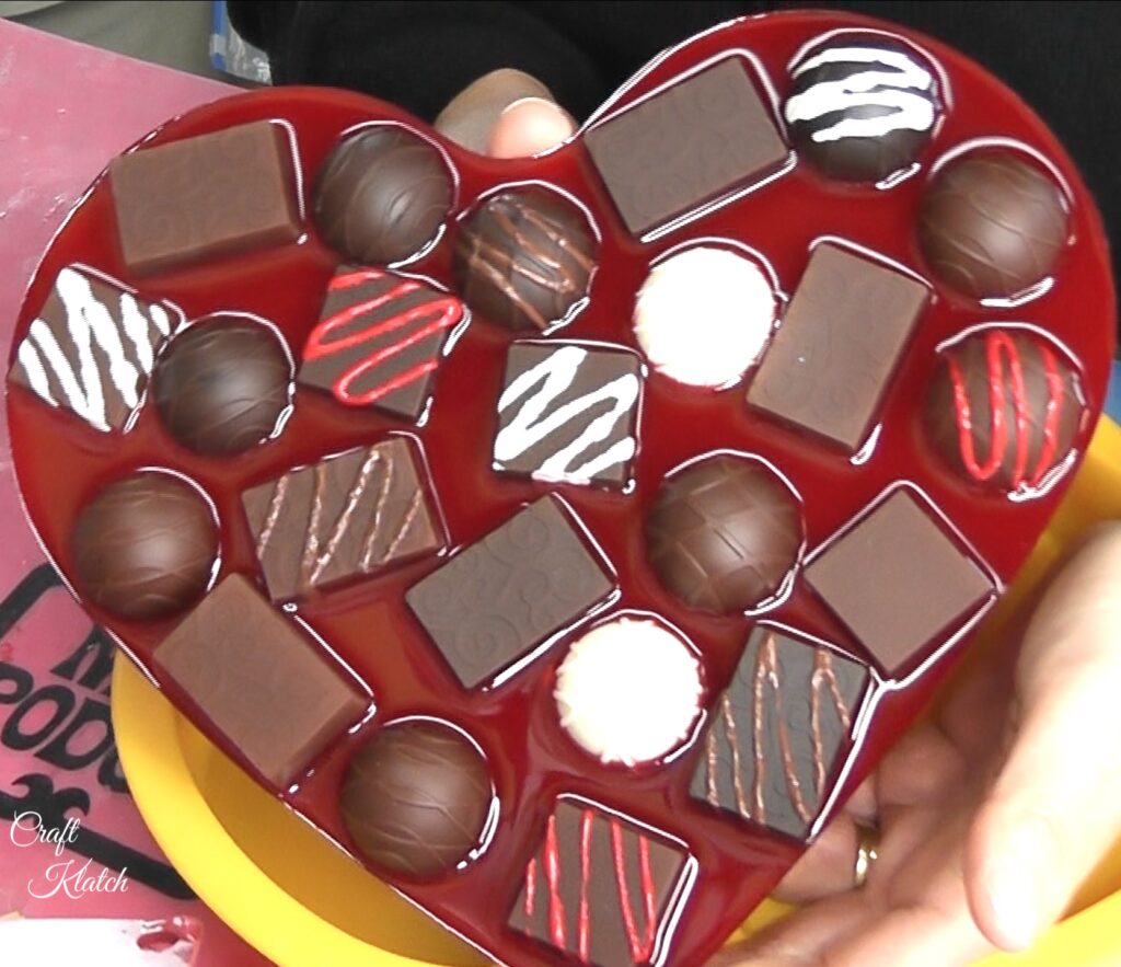 Red resin heart and chocolates pulled out of mold