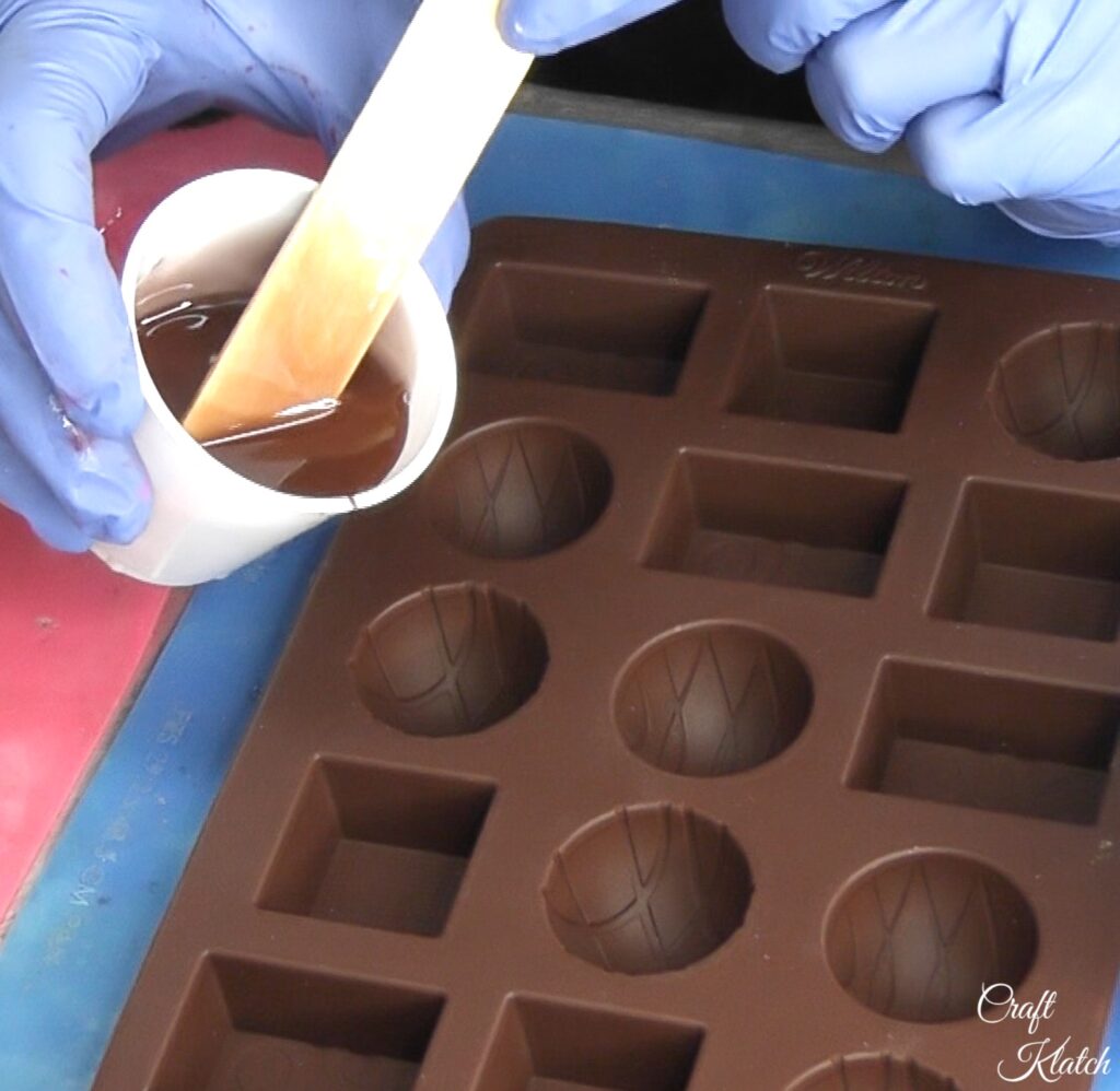 Pour brown resin into candy mold