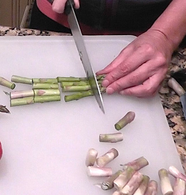 Orzo Summer Pasta Salad Cut asparagus into one inch pieces with knife