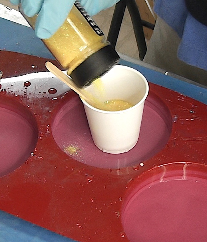 Mix yellow glitter and resin for skull coaster