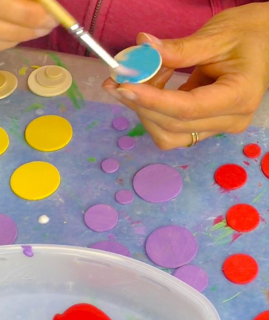 Painting purple, yellow, red and blue circles
