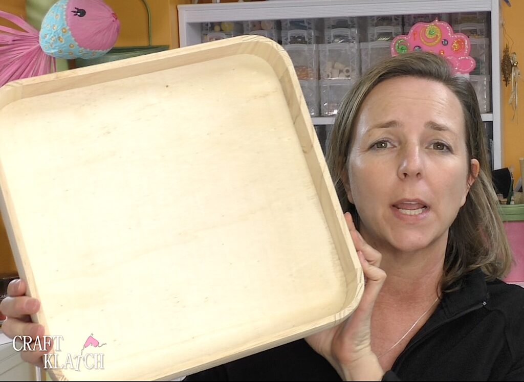 Mona holding unfinished wood tray