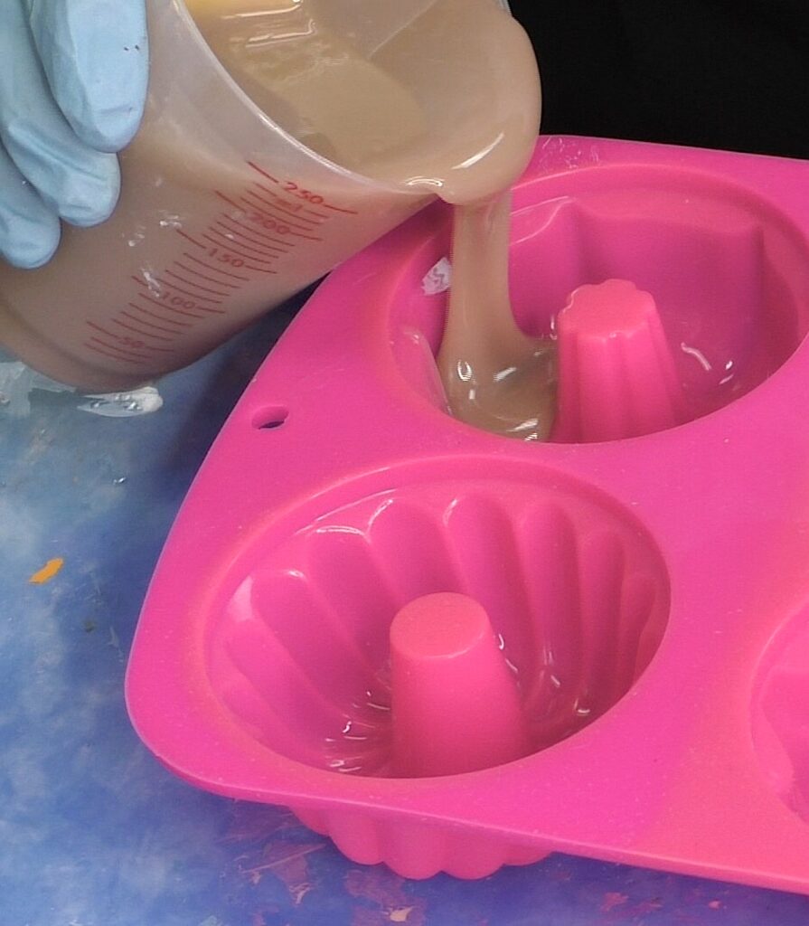Pour the batter colored resin into the silicone cake mold