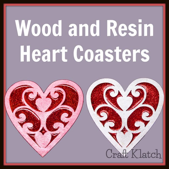 Wood and resin heart coasters on with pink framing and one with silver framing