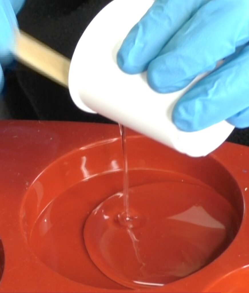 Pour one ounce of resin into the silicone coaster mold