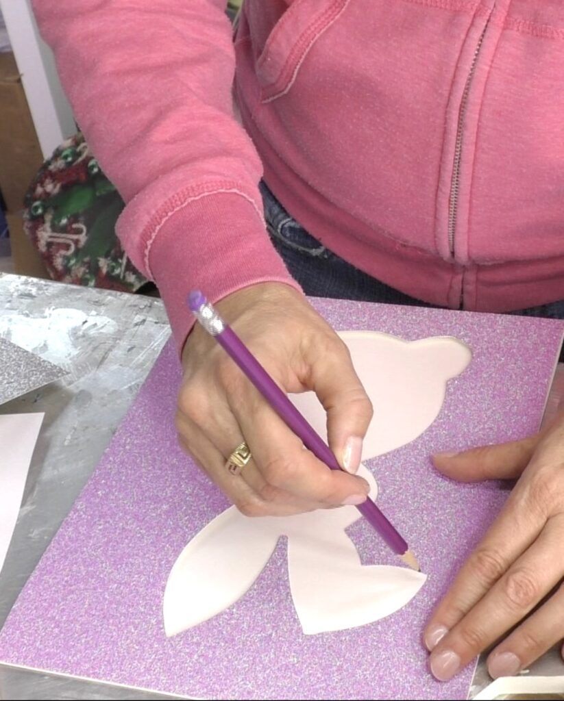 Tracing easter bunny art shape onto white paper