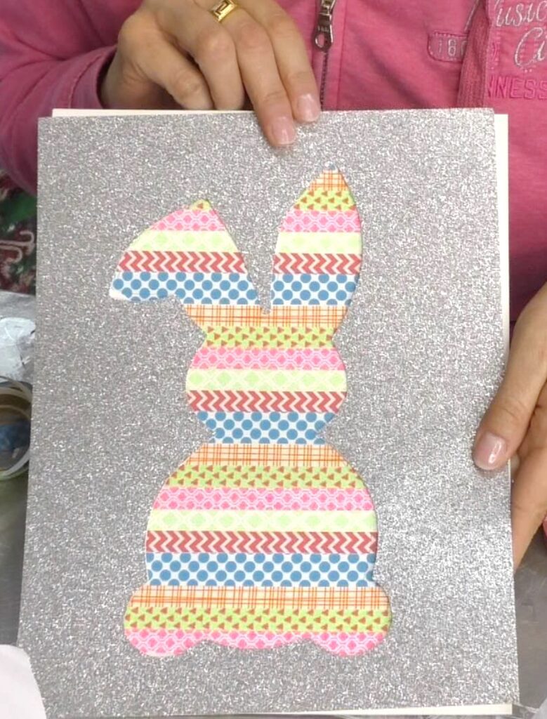 holding silver glitter paper over the washi tape bunny