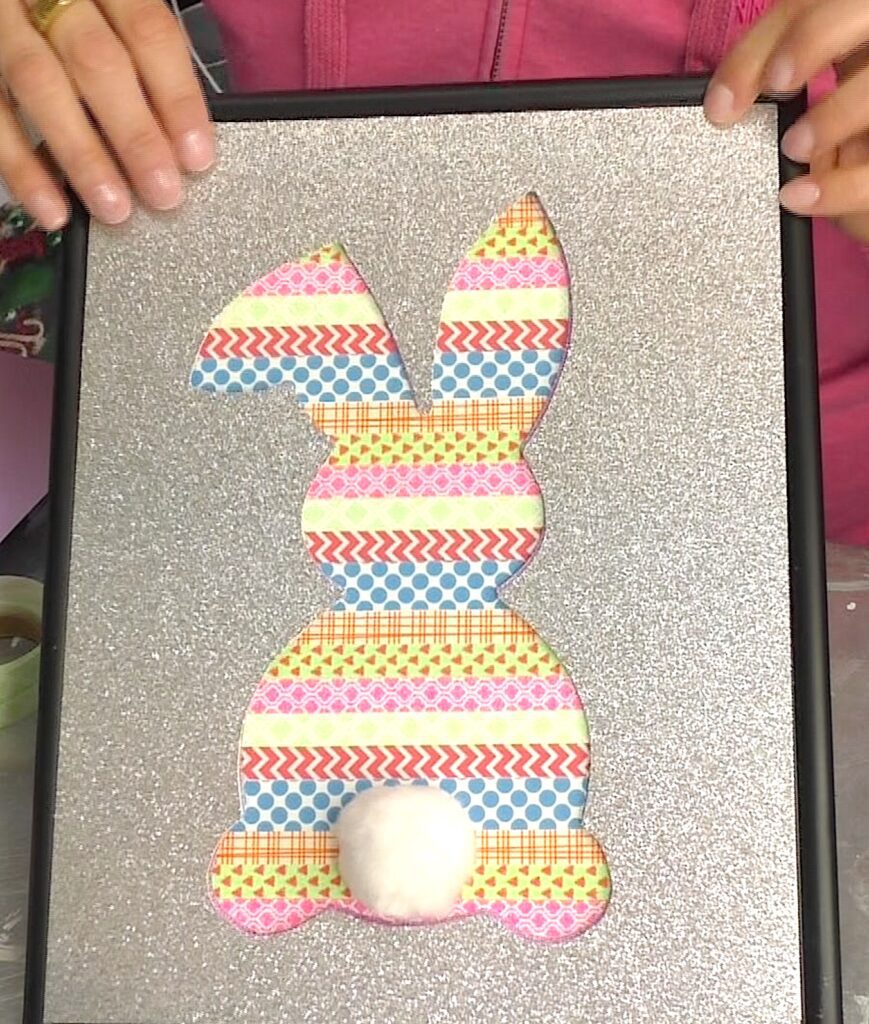 holding silver glitter scrapbook paper over the washi tape easter bunny art