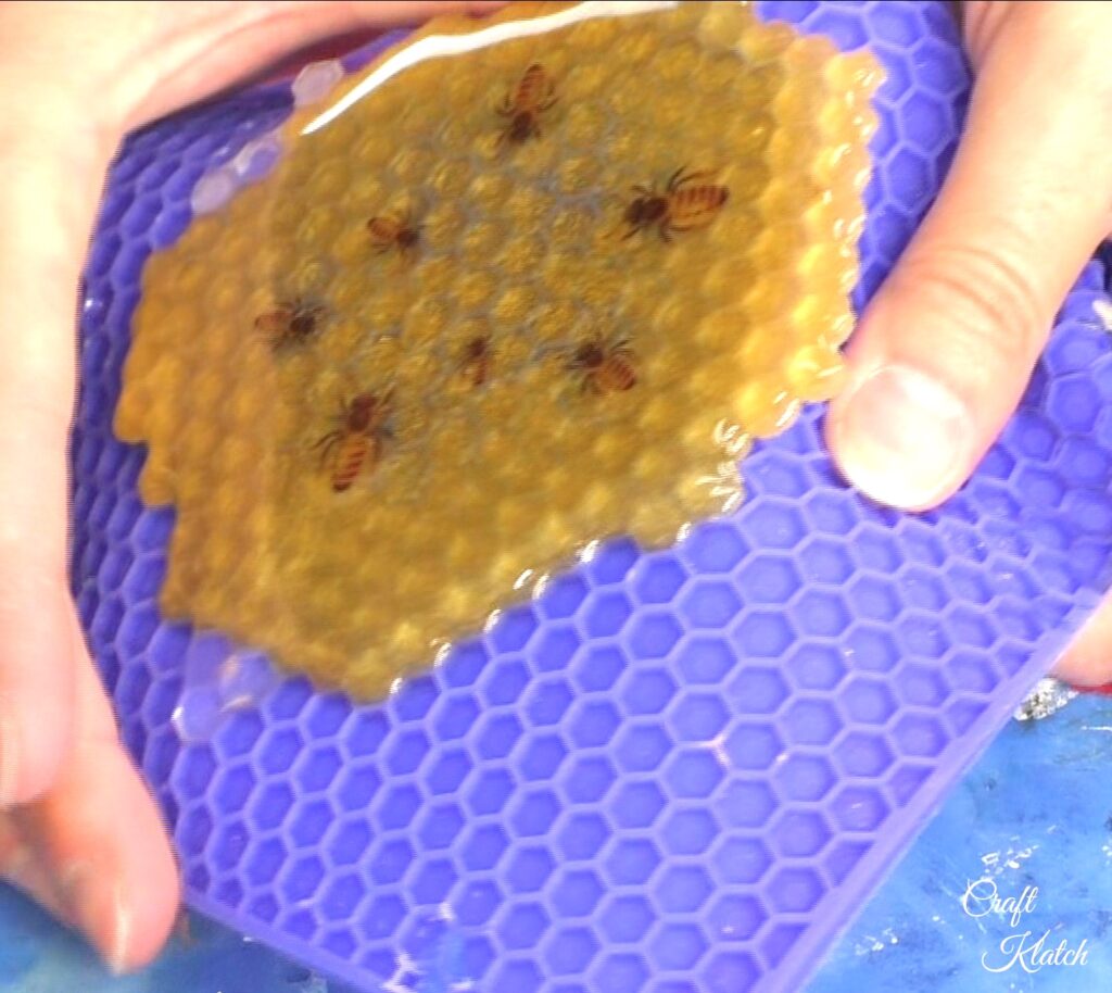 Remove honeycomb bee coaster off mat