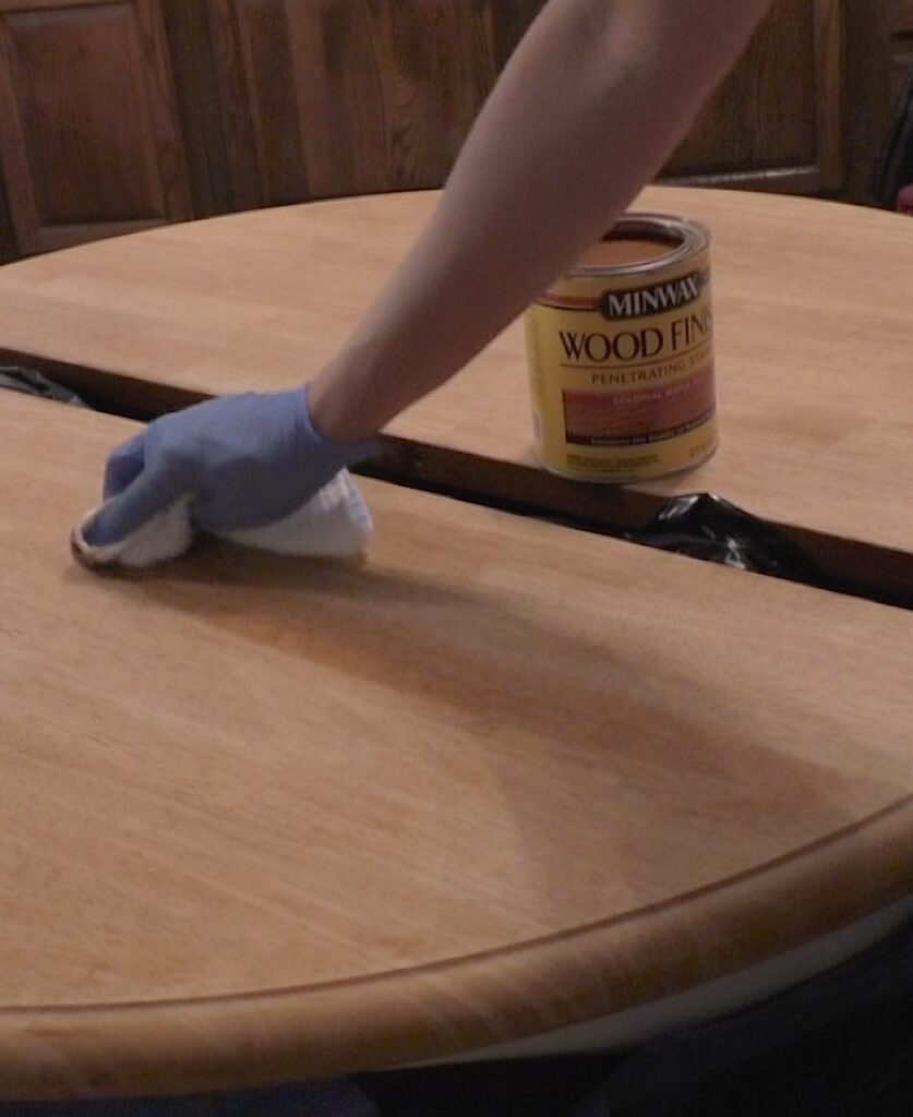 Applying stain to the kitchen table refinish