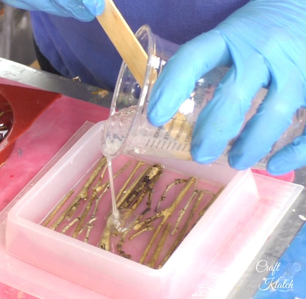 Pour resin over the twigs in the square coaster mold