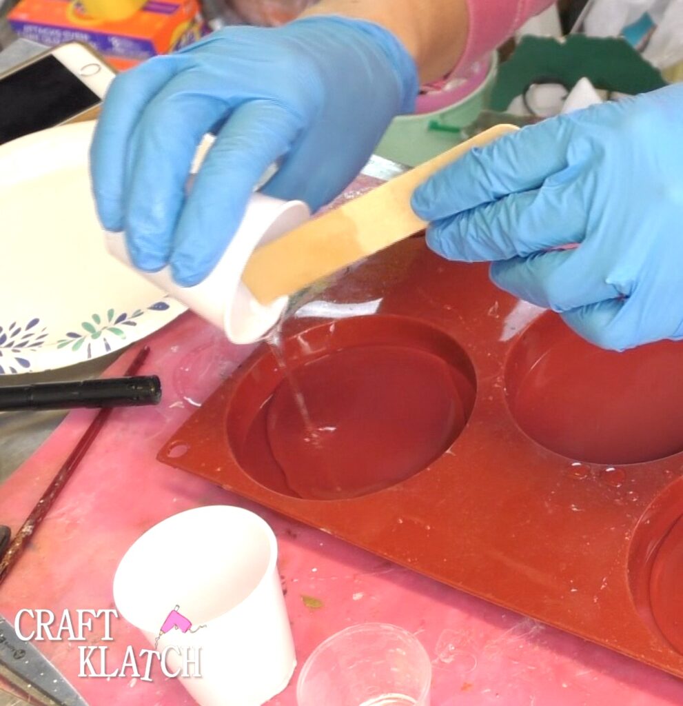 Pour clear epoxy resin into coaster mold