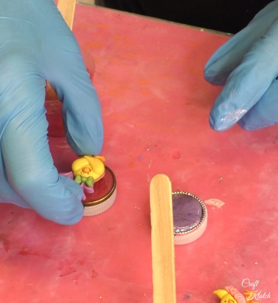 Place chick into resin filled bezel 