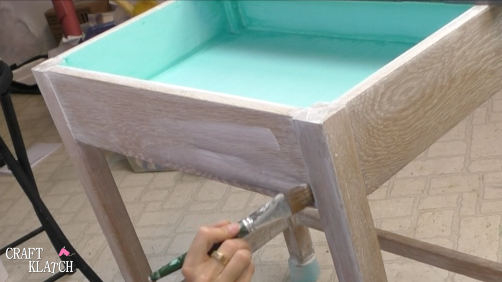 Learn how to makeover a desk using UnicornSpit and Glaze Coat! | furniture | furniture makeover | desk makeover | furniture redo | diy | home decor | Unicorn Spit | #diy #unicornspit #glazecoat #furniture #furnituremakeover #furnitureredo #homedecor #deskmakeover Brushing on second coat of white Unicorn Spit onto base of desk