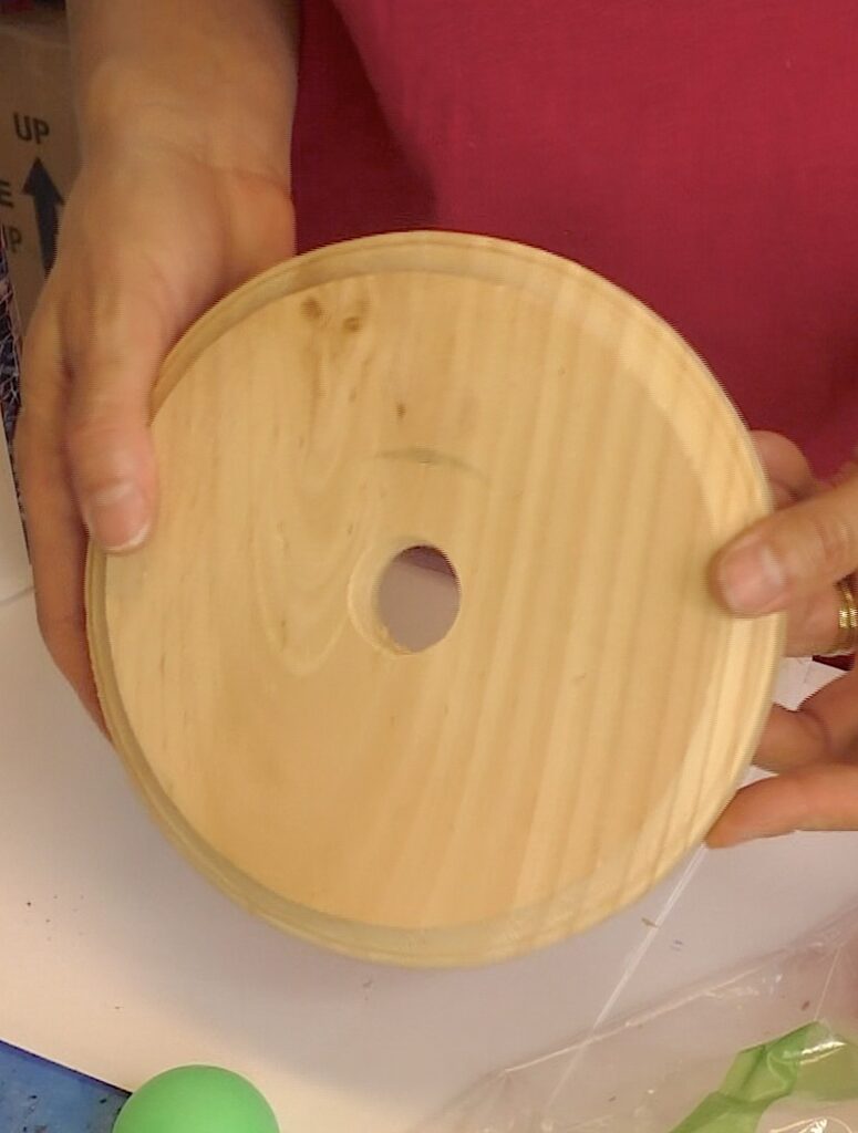 Base for the gumball lamp is wood plaque with hole drilled in the middle