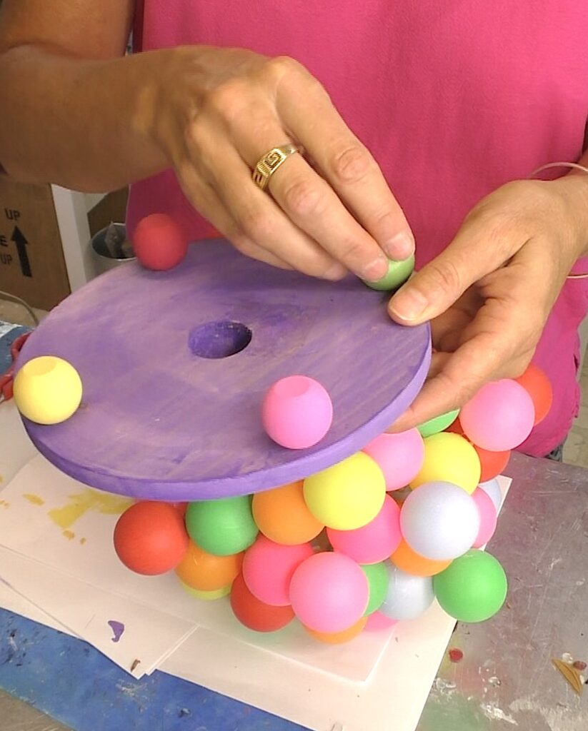 Glue the painted wood balls to the bottom of the plaque for the diy lamp ideas