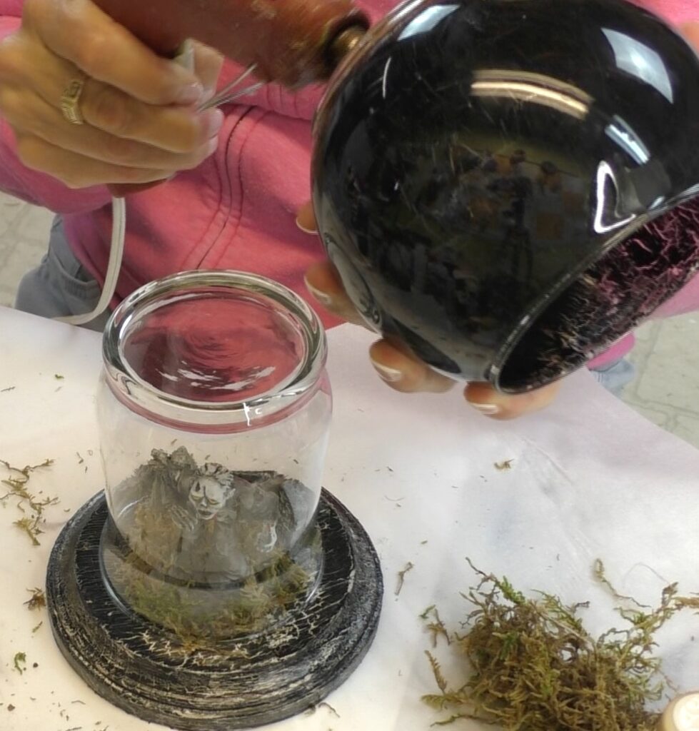 Glue the black crackled votive to the bottom of the upside down glass for the DIY easy Halloween decorations