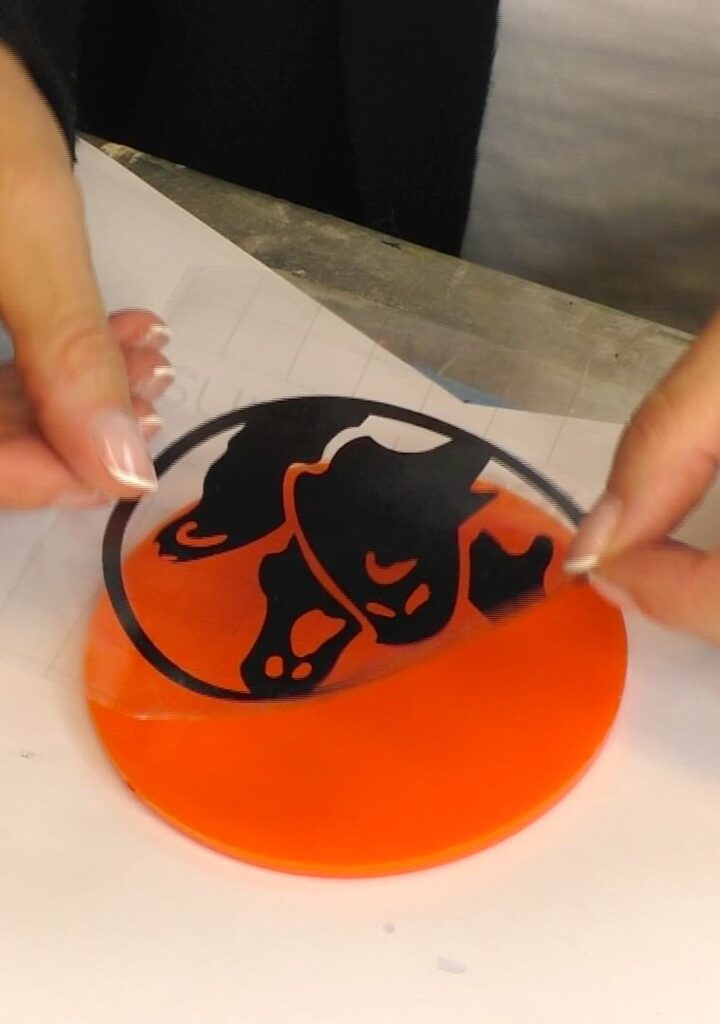 Applying the ghost cricut cut out to the Halloween craft