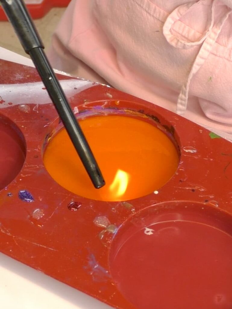 Using lighter to pop bubbles for the ghost coaster