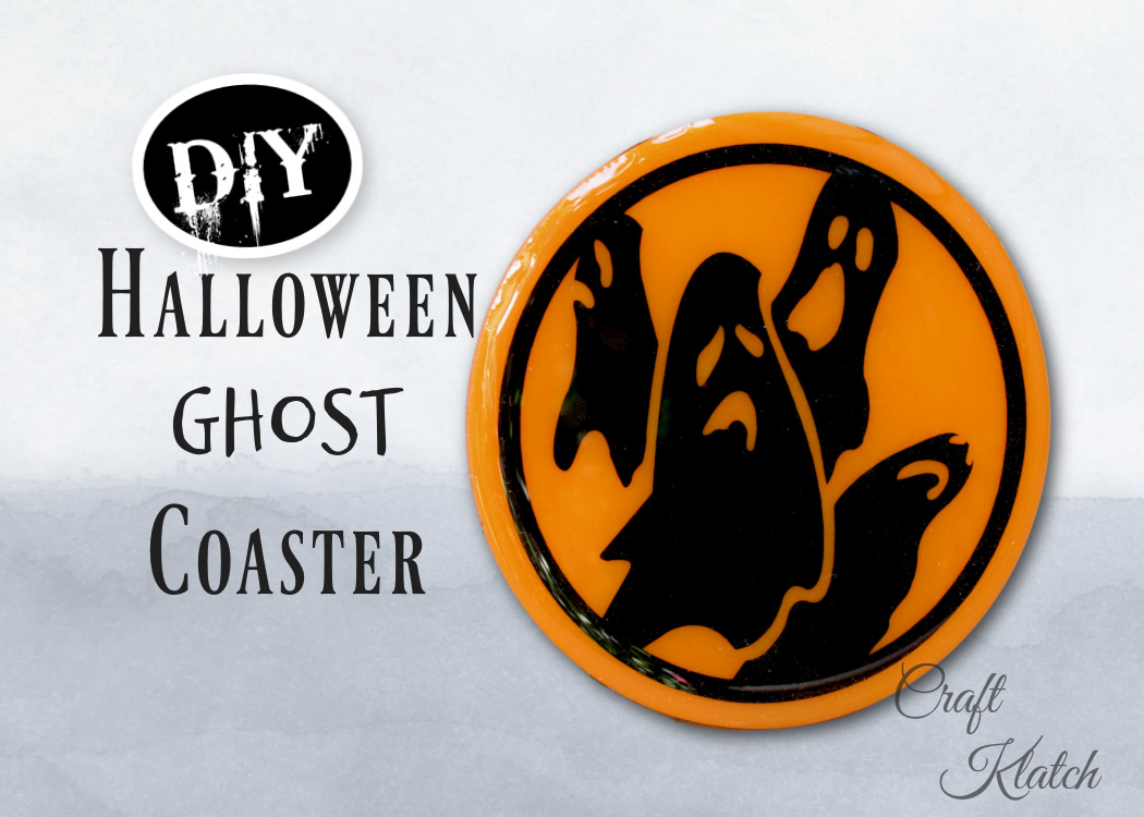 Halloween craft ghost coaster with orange background and ghost silhouettes