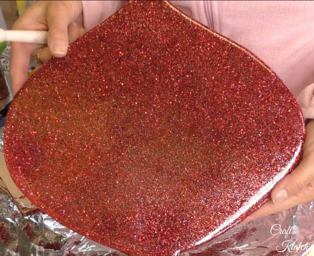 Dollar Tree Ornament Makeover #2 and this time we added glitz and glam to the Christmas decoration tutorial! A little resin and glitter make holiday art! Fun Christmas craft ideas! #craftklatch #craftideas #chiristmas #christmascrafts #resin #resinart #dollartree #dollartreecrafts #dollartreediys