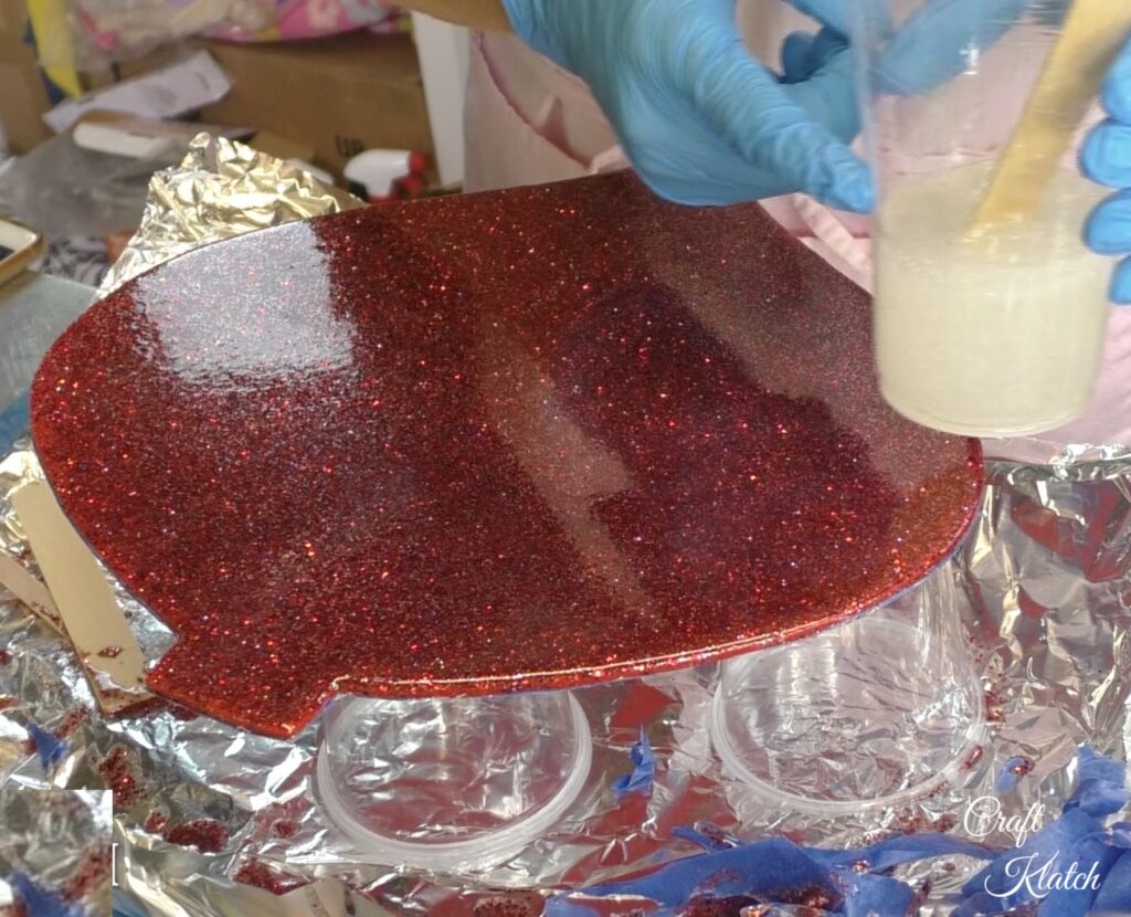 Dollar Tree Ornament Makeover #2 and this time we added glitz and glam to the Christmas decoration tutorial! A little resin and glitter make holiday art! Fun Christmas craft ideas! #craftklatch #craftideas #chiristmas #christmascrafts #resin #resinart #dollartree #dollartreecrafts #dollartreediys