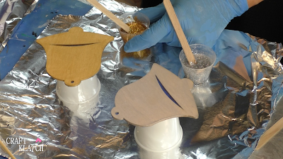 Learn how to make Christmas Bell Resin coasters! It's great home decor idea for decorating for the holidays and because the wood cutouts are from Dollar Tree, they are great for decorating on a budget! #craftklatch #craftideas #christmas #christmascraftideas #christmascrafts #diy #howto #crafts #crafting #glittercrafts #resin #resincrafts #resindiys #resinart #resincoasters #dollartree #dollartreecrafts #decoratingonabudget