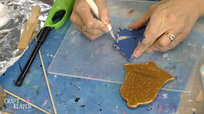 Learn how to make Christmas Bell Resin coasters! It's great home decor idea for decorating for the holidays and because the wood cutouts are from Dollar Tree, they are great for decorating on a budget! #craftklatch #craftideas #christmas #christmascraftideas #christmascrafts #diy #howto #crafts #crafting #glittercrafts #resin #resincrafts #resindiys #resinart #resincoasters #dollartree #dollartreecrafts #decoratingonabudget