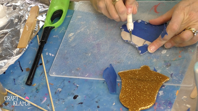 Learn how to make Christmas Bell Resin coasters! It's great home decor idea for decorating for the holidays and because the wood cutouts are from Dollar Tree, they are great for decorating on a budget! #craftklatch #craftideas #christmas #christmascraftideas #christmascrafts #diy #howto #crafts #crafting #glittercrafts #resin #resincrafts #resindiys #resinart #resincoasters #dollartree #dollartreecrafts #decoratingonabudget