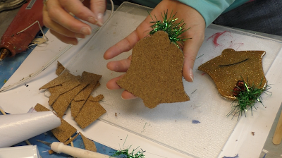 Learn how to make Christmas Bell Resin coasters! It's great home decor idea for decorating for the holidays and because the wood cutouts are from Dollar Tree, they are great for decorating on a budget! #craftklatch #craftideas #christmas #christmascraftideas #christmascrafts #diy #howto #crafts #crafting #glittercrafts #resin #resincrafts #resindiys #resinart #resincoasters #dollartree #dollartreecrafts #decoratingonabudget