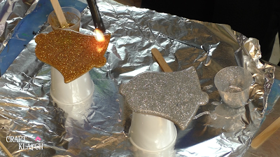 Learn how to make Christmas Bell Resin coasters! It's great home decor idea for decorating for the holidays and because the wood cutouts are from Dollar Tree, they are great for decorating on a budget! #craftklatch #craftideas #christmas #christmascraftideas #christmascrafts #diy #howto #crafts #crafting #glittercrafts #resin #resincrafts #resindiys #resinart #resincoasters #dollartree #dollartreecrafts #decoratingonabudget