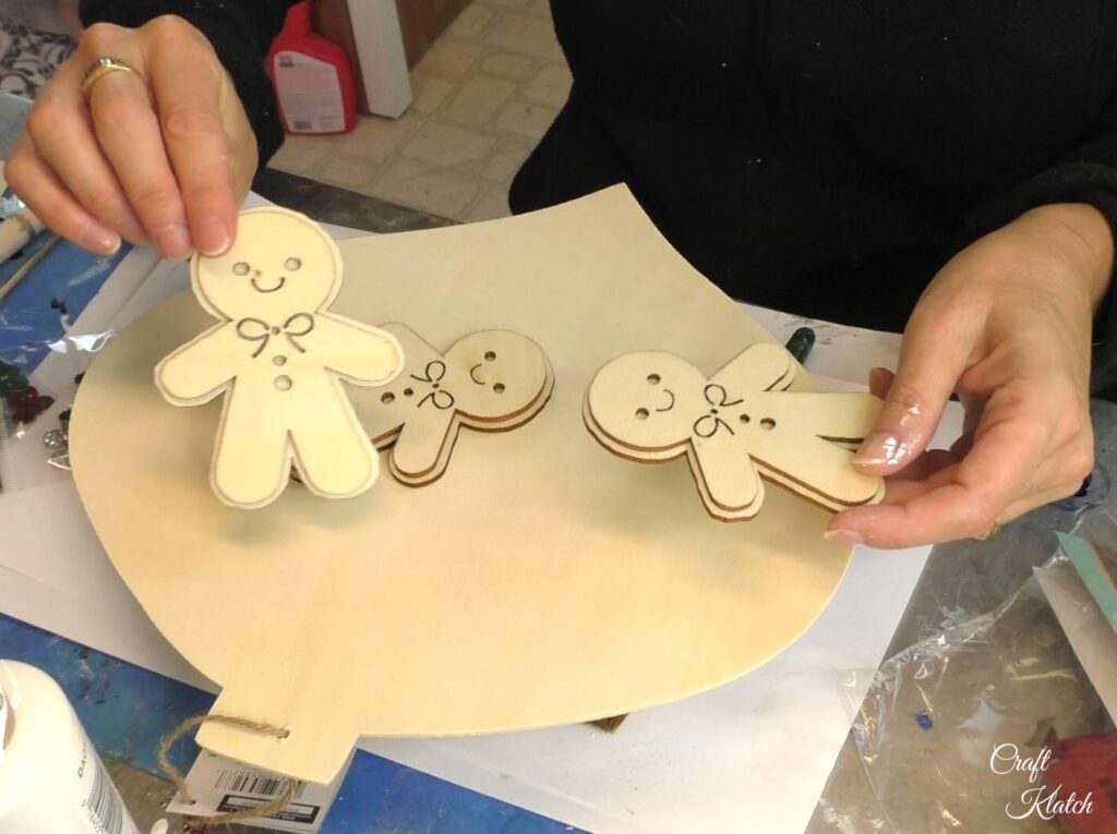 Holding unfinished wood gingerbread men